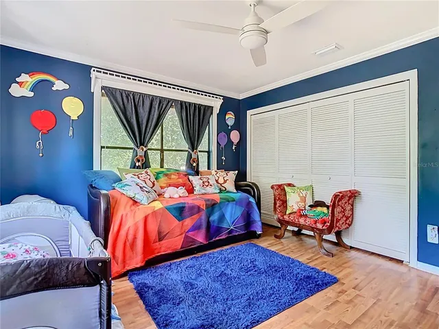 a view of a chairs and table in backyard of a house