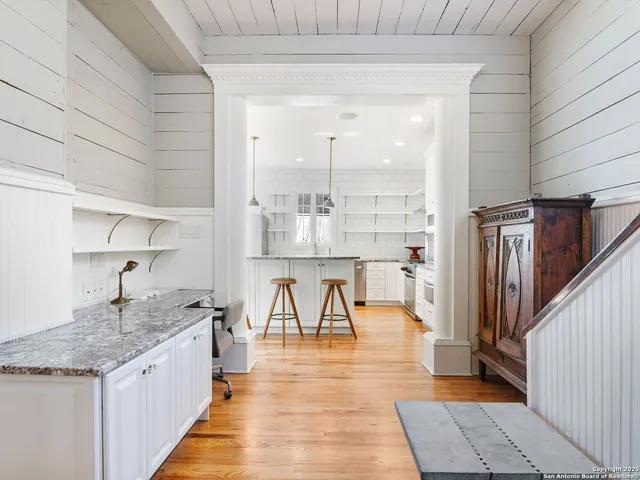 a kitchen with kitchen island granite countertop lots of counter top space and appliances