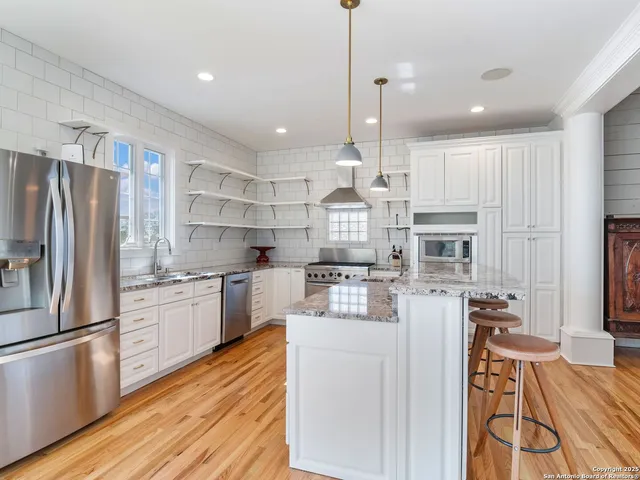 a kitchen with a stove and a sink