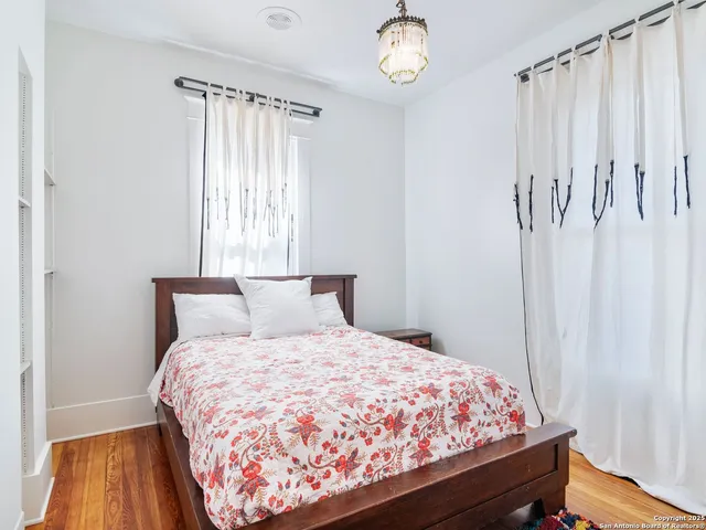 a bed room with a bed and a window