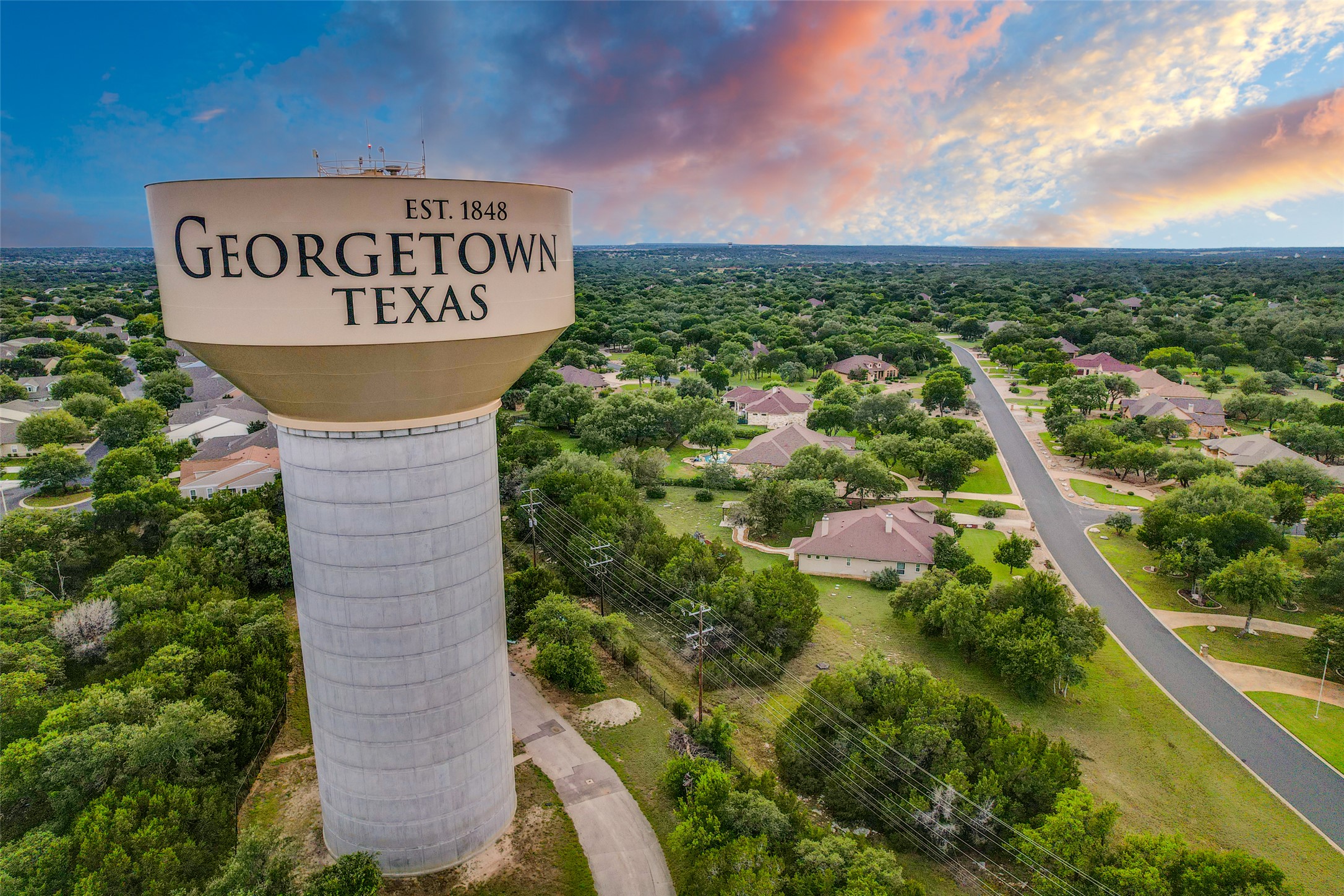 101 Copper Leaf Court Georgetown, TX 78633 - Photo 30 of 31 Aerial perspective showcasing the Georgetown water tower and surrounding residential area