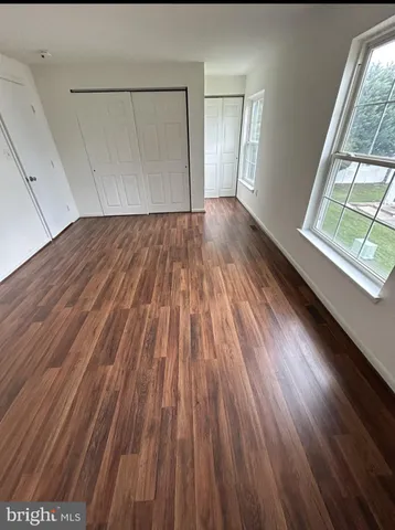 a view of wooden floor in an empty room