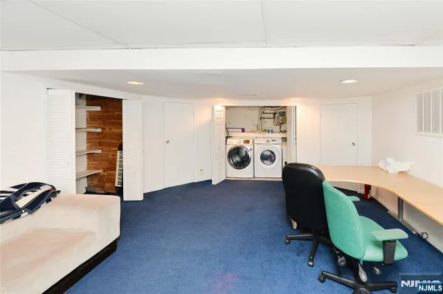 a view of a workspace with furniture and a chair