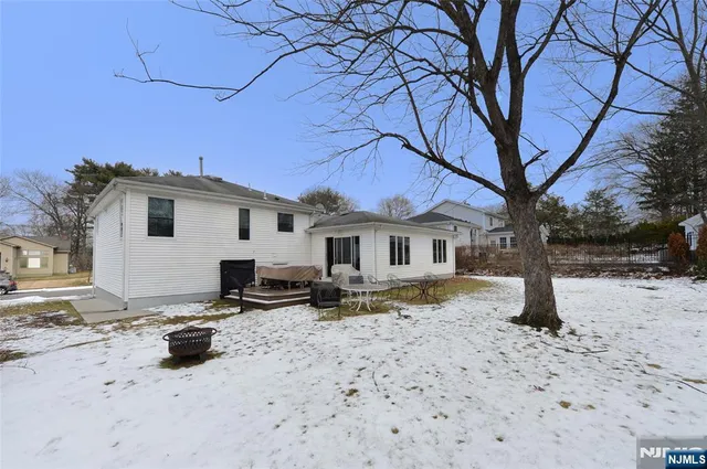 a view of a house with a snow in front of house
