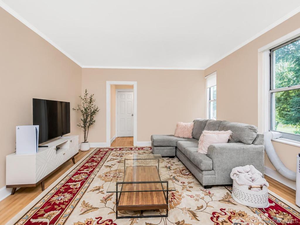 472 Gramatan Avenue, Unit O2 Mount Vernon, NY 10552 - Photo 6 of 13 a living room with furniture and a flat screen tv