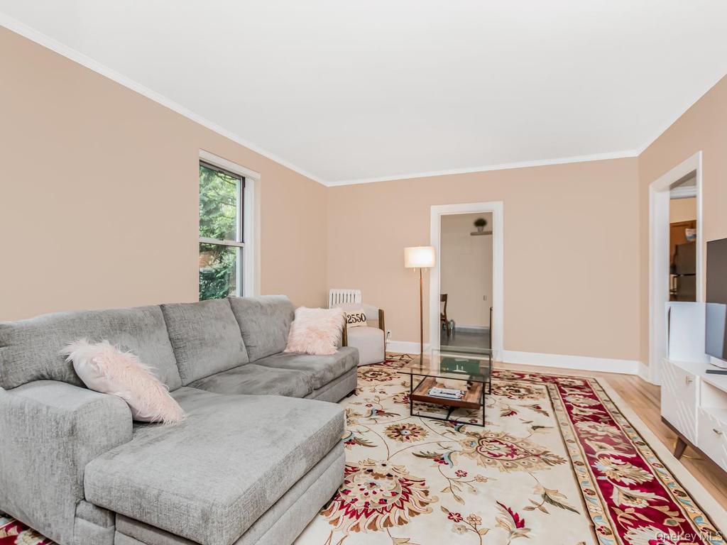 472 Gramatan Avenue, Unit O2 Mount Vernon, NY 10552 - Photo 7 of 13 a living room with furniture and a rug
