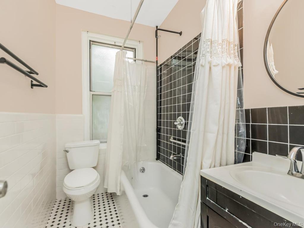 472 Gramatan Avenue, Unit O2 Mount Vernon, NY 10552 - Photo 9 of 13 a bathroom with a sink toilet and shower