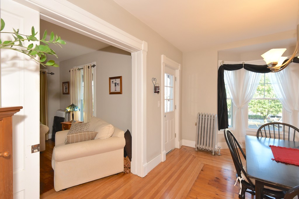 7 Chadwick Street Worcester, MA 01605 - Photo 11 of 30 a living room with furniture a wooden floor and a large window