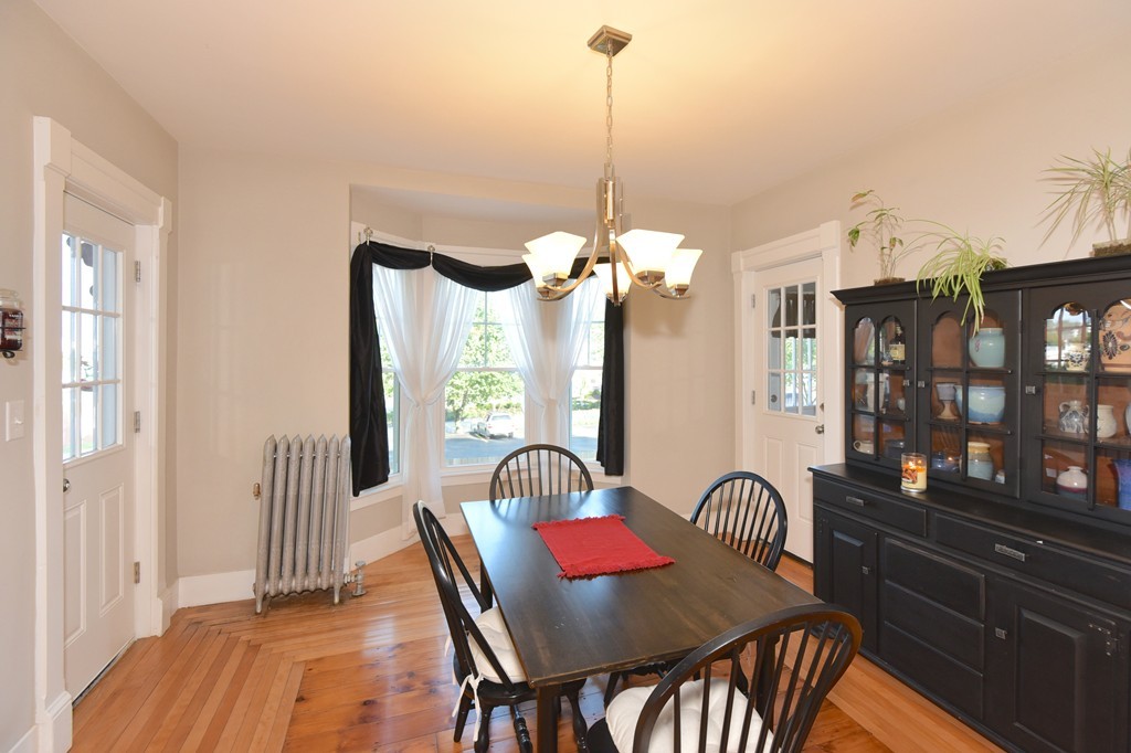 7 Chadwick Street Worcester, MA 01605 - Photo 13 of 30 a view of a dining room with furniture window and wooden floor