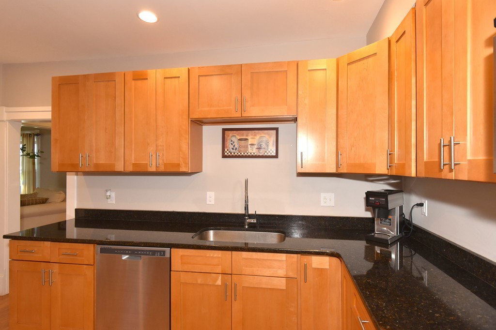 7 Chadwick Street Worcester, MA 01605 - Photo 16 of 30 a kitchen with stainless steel appliances a sink and cabinets