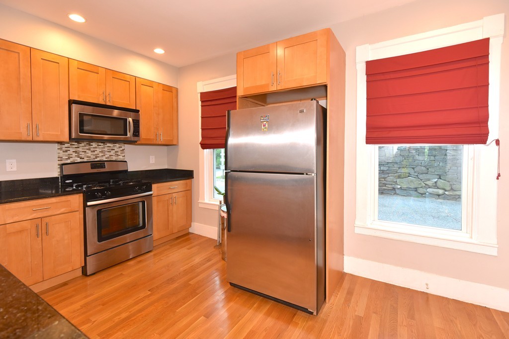 7 Chadwick Street Worcester, MA 01605 - Photo 17 of 30 a kitchen with stainless steel appliances a refrigerator sink and microwave