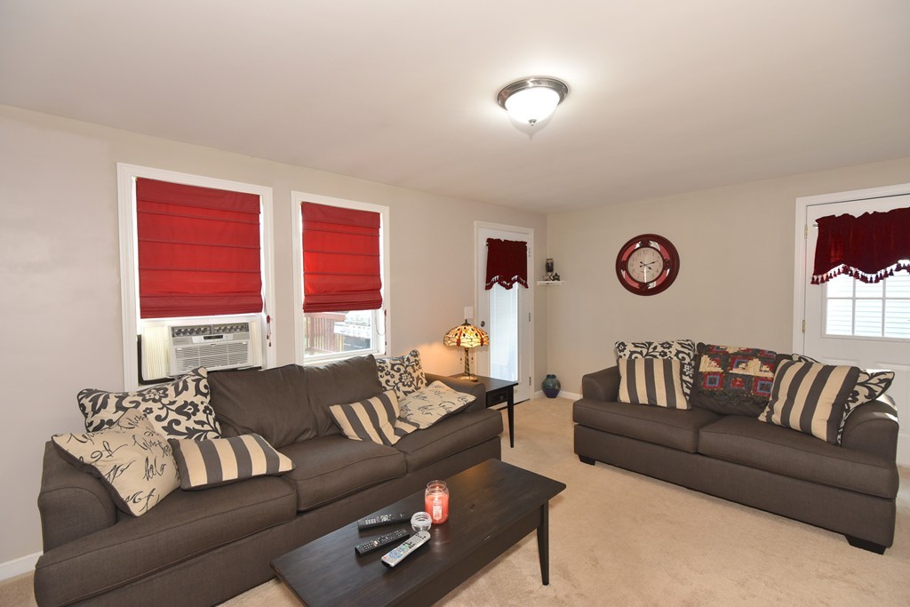 7 Chadwick Street Worcester, MA 01605 - Photo 18 of 30 a living room with furniture and a large window