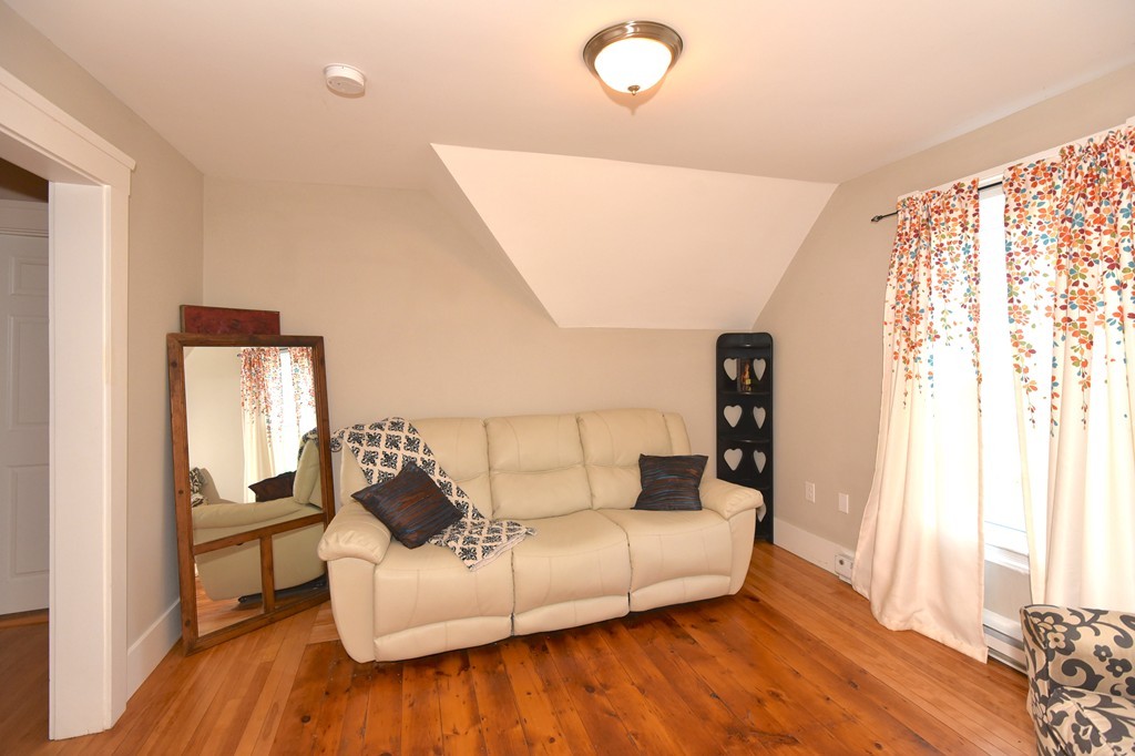 7 Chadwick Street Worcester, MA 01605 - Photo 22 of 30 a living room with furniture and wooden floor