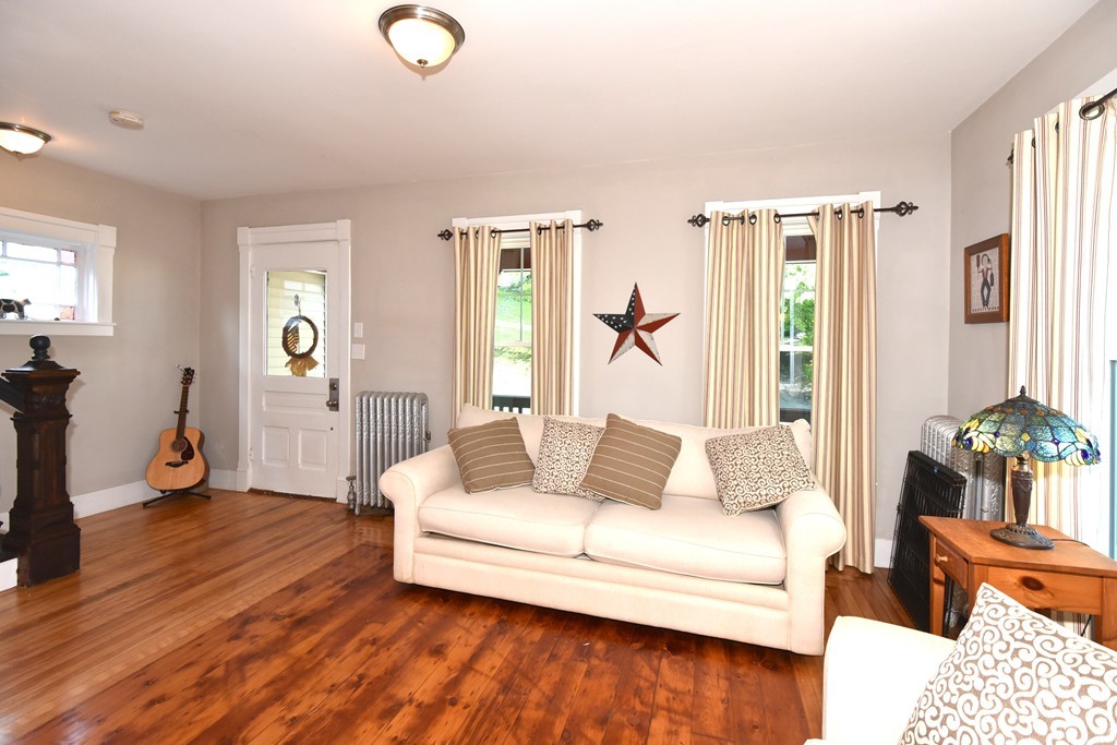 7 Chadwick Street Worcester, MA 01605 - Photo 6 of 30 a living room with furniture and wooden floor