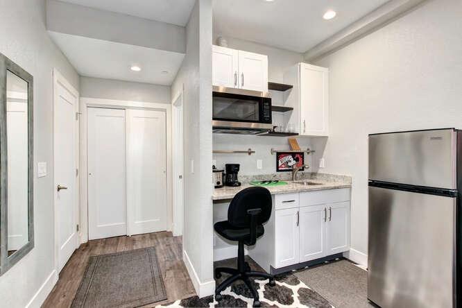 1409 Victorian Alley Sacramento, CA 95818 - Photo 32 of 45 a kitchen with stainless steel appliances a stove a sink and a refrigerator