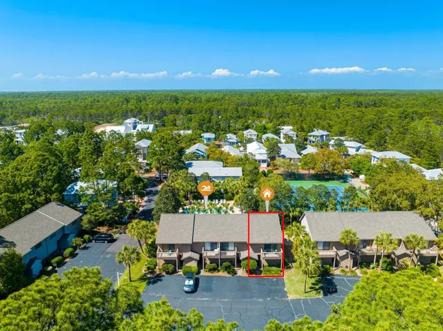 an aerial view of residential houses with outdoor space