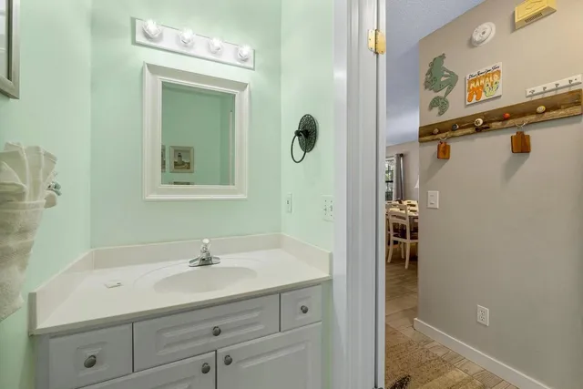 a bathroom with a sink and mirror