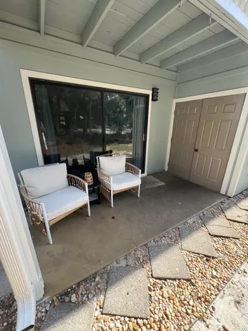 a living room with furniture and a rug