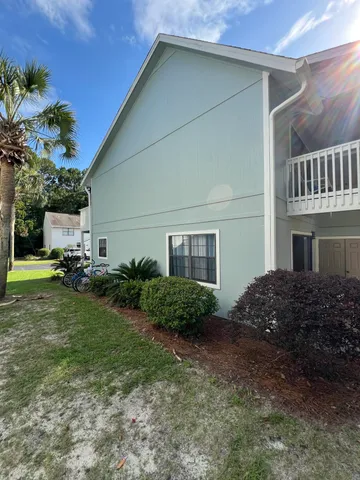 a view of a house with a back yard