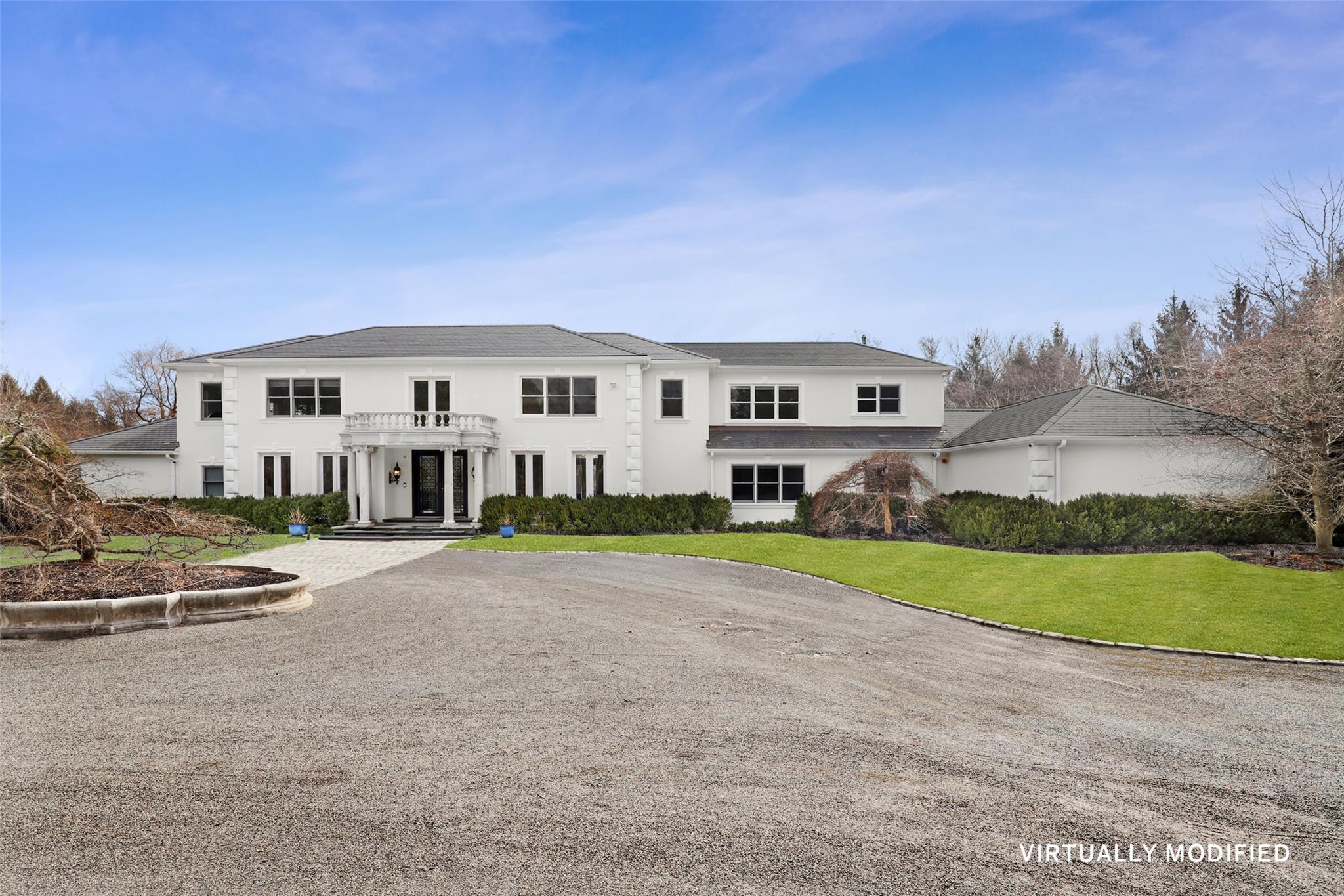 a view of a house with a yard and fence
