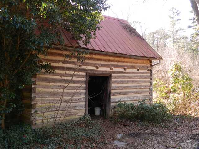 2131 Marions Ford Road Chapel Hill, NC 27516 - Photo 4 of 25 Oak log kitchen house built between 1810 and 1820. Fieldstone fireplace has been re-pointed.