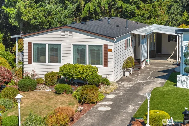 a front view of a house with garden