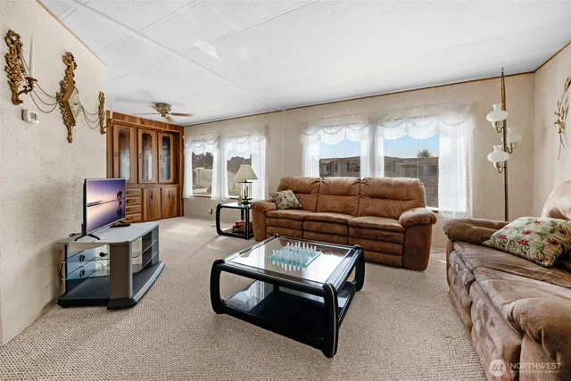 a living room with furniture and a window