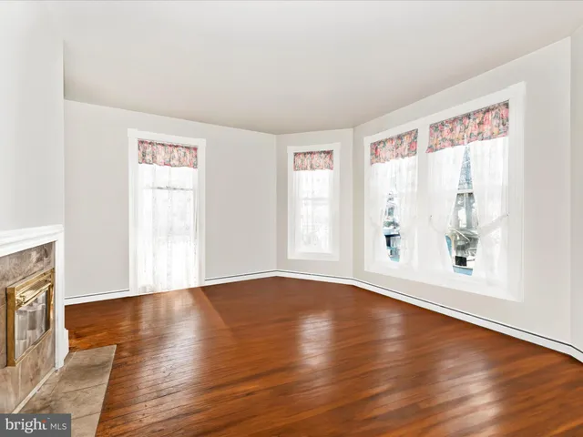 a kitchen with stainless steel appliances granite countertop a stove a sink and a wooden cabinets