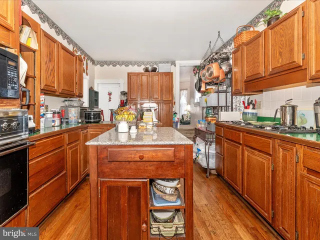 a bedroom with furniture and a flat screen tv