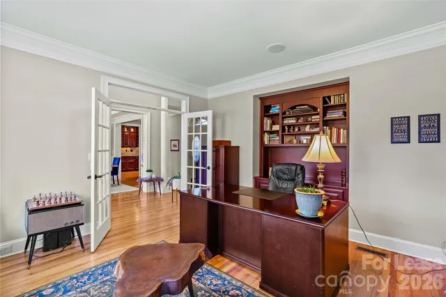 a living room with furniture and a closet