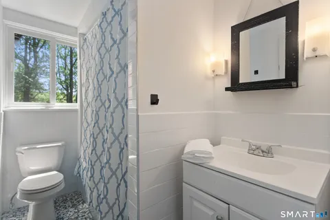 a bedroom with a bed and furniture