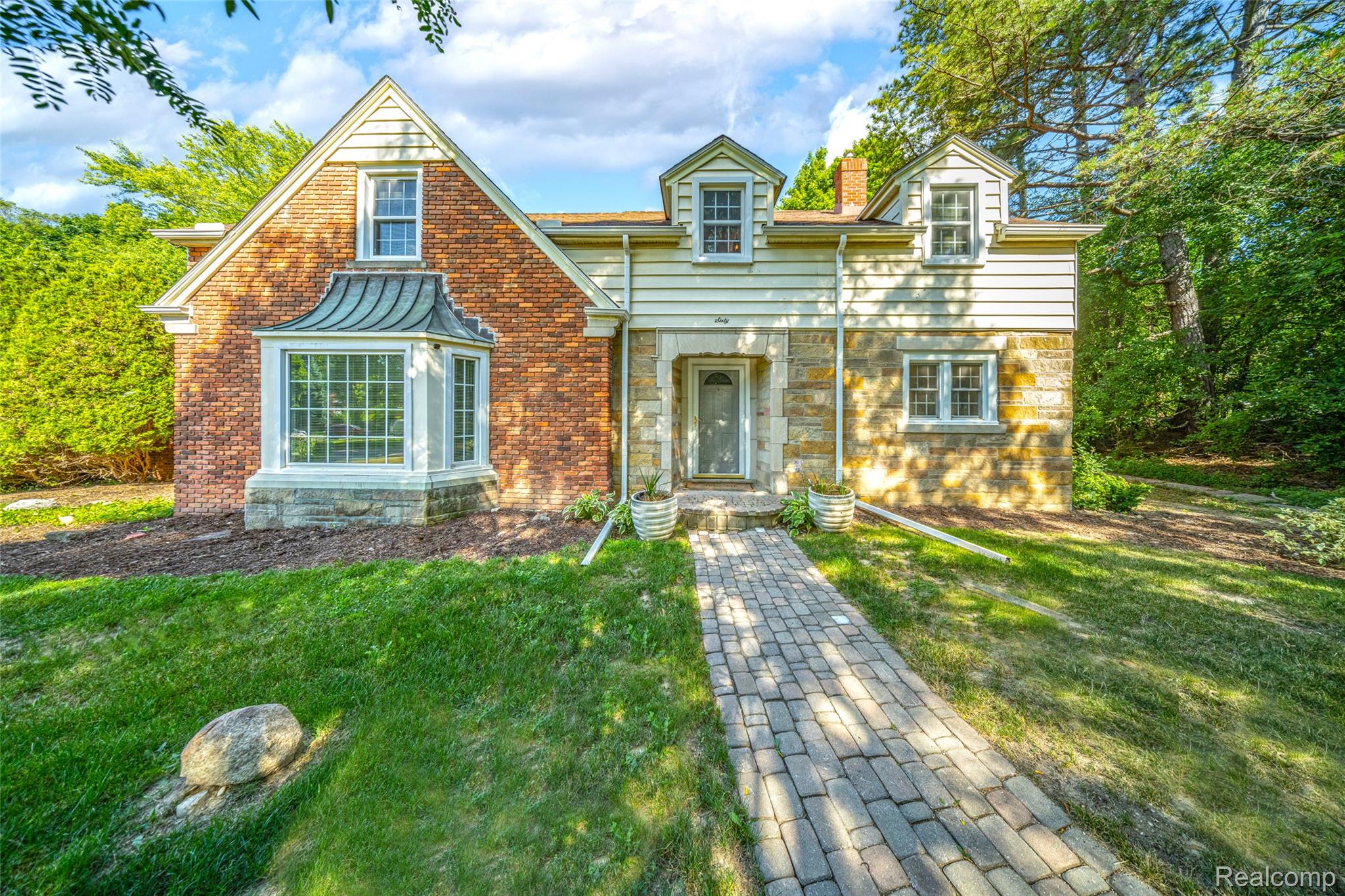 60 Devon Road Bloomfield Hills, MI 48302 - Photo 45 of 50 Brick and stone facade with multiple gables and dormer windows