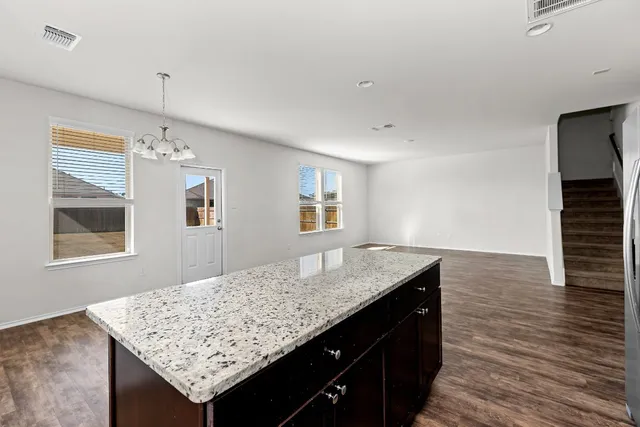 an aerial view of a house with a ocean view
