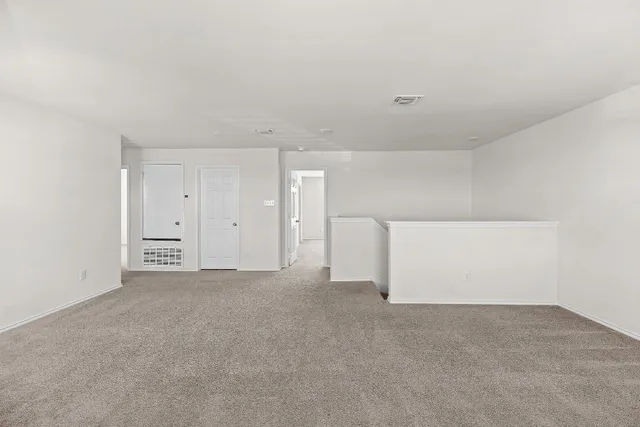 a kitchen with a refrigerator sink and stainless steel appliances