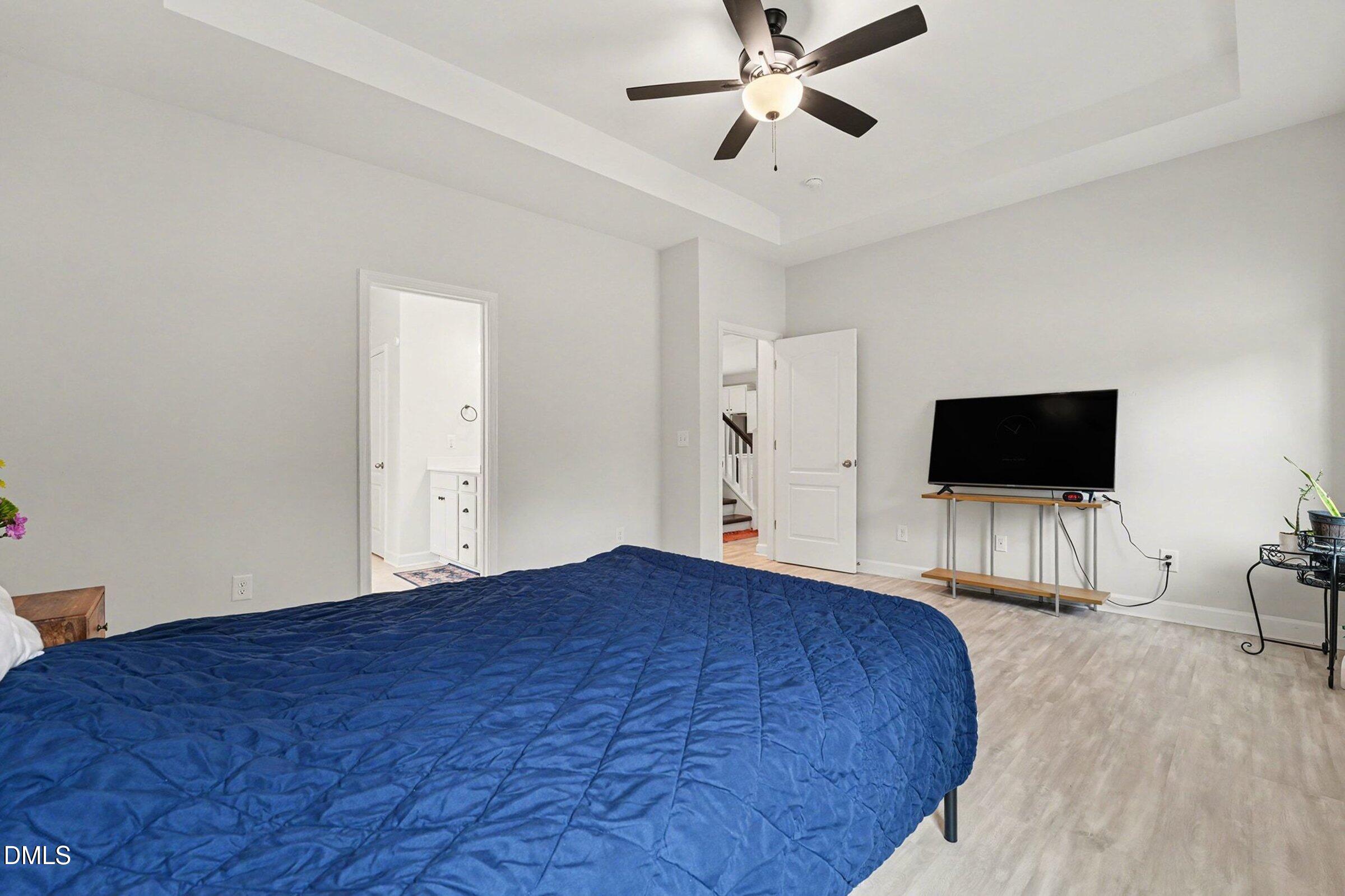 365 Timber Skip Drive Spring Lake, NC 28390 - Photo 16 of 33 a bedroom with a bed and a flat screen tv