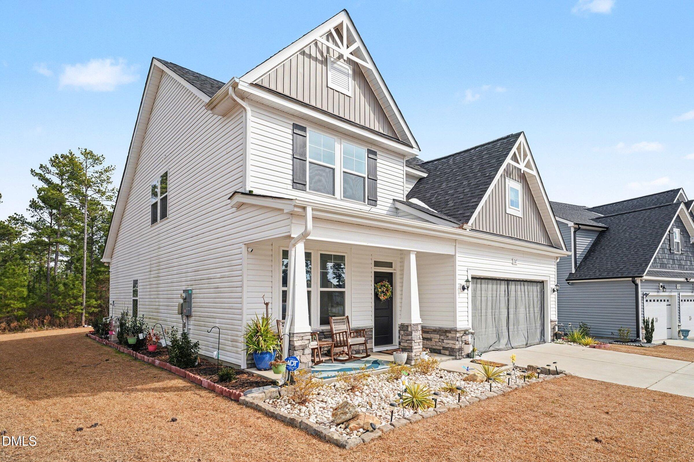 365 Timber Skip Drive Spring Lake, NC 28390 - Photo 2 of 33 a view of a house with wooden walls and a small yard