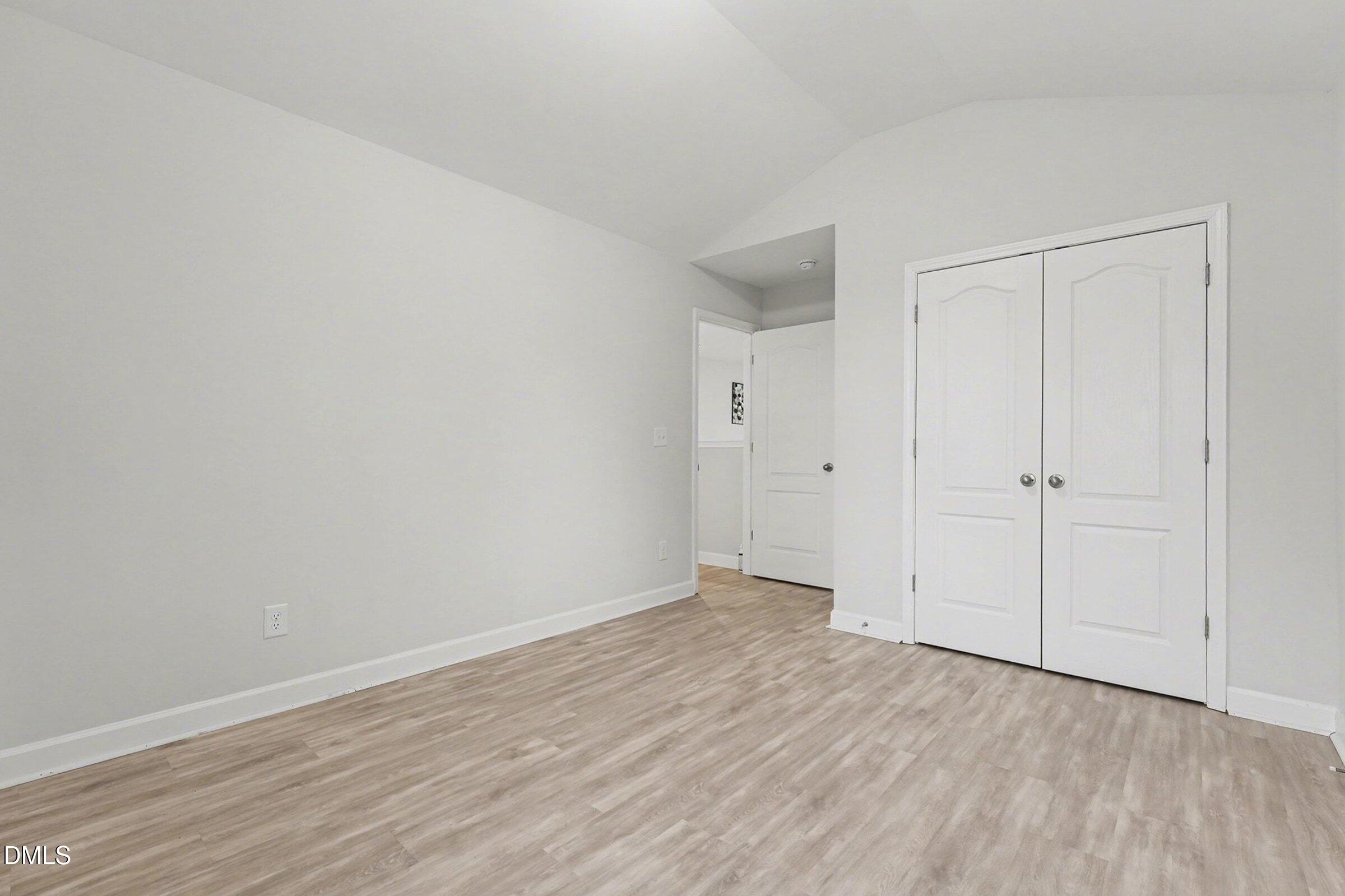 365 Timber Skip Drive Spring Lake, NC 28390 - Photo 21 of 33 a view of an empty room with wooden floor