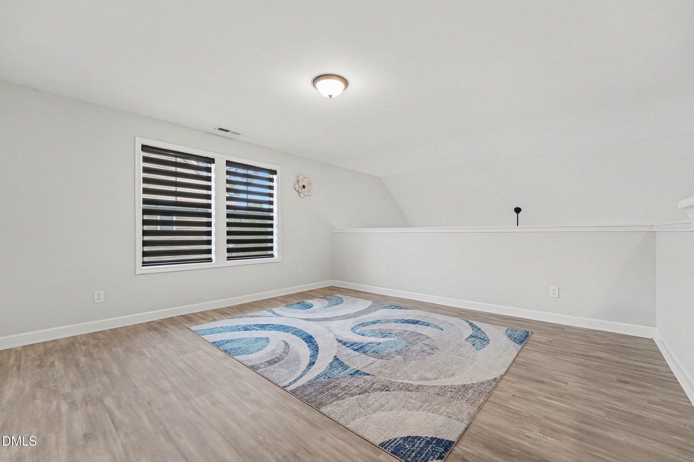 365 Timber Skip Drive Spring Lake, NC 28390 - Photo 23 of 33 a view of a livingroom with wooden floor and window