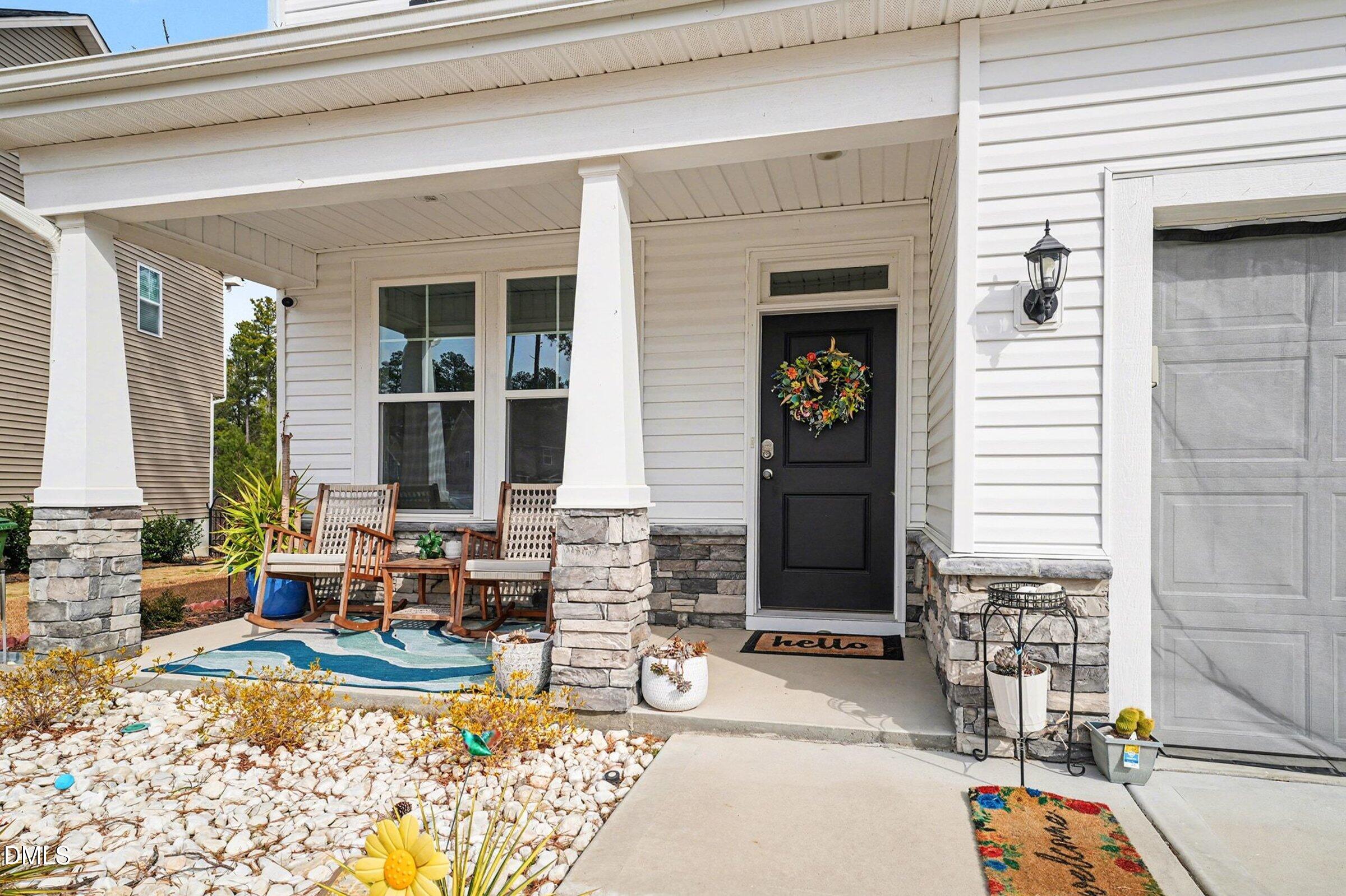 365 Timber Skip Drive Spring Lake, NC 28390 - Photo 4 of 33 a front view of a house with outdoor seating