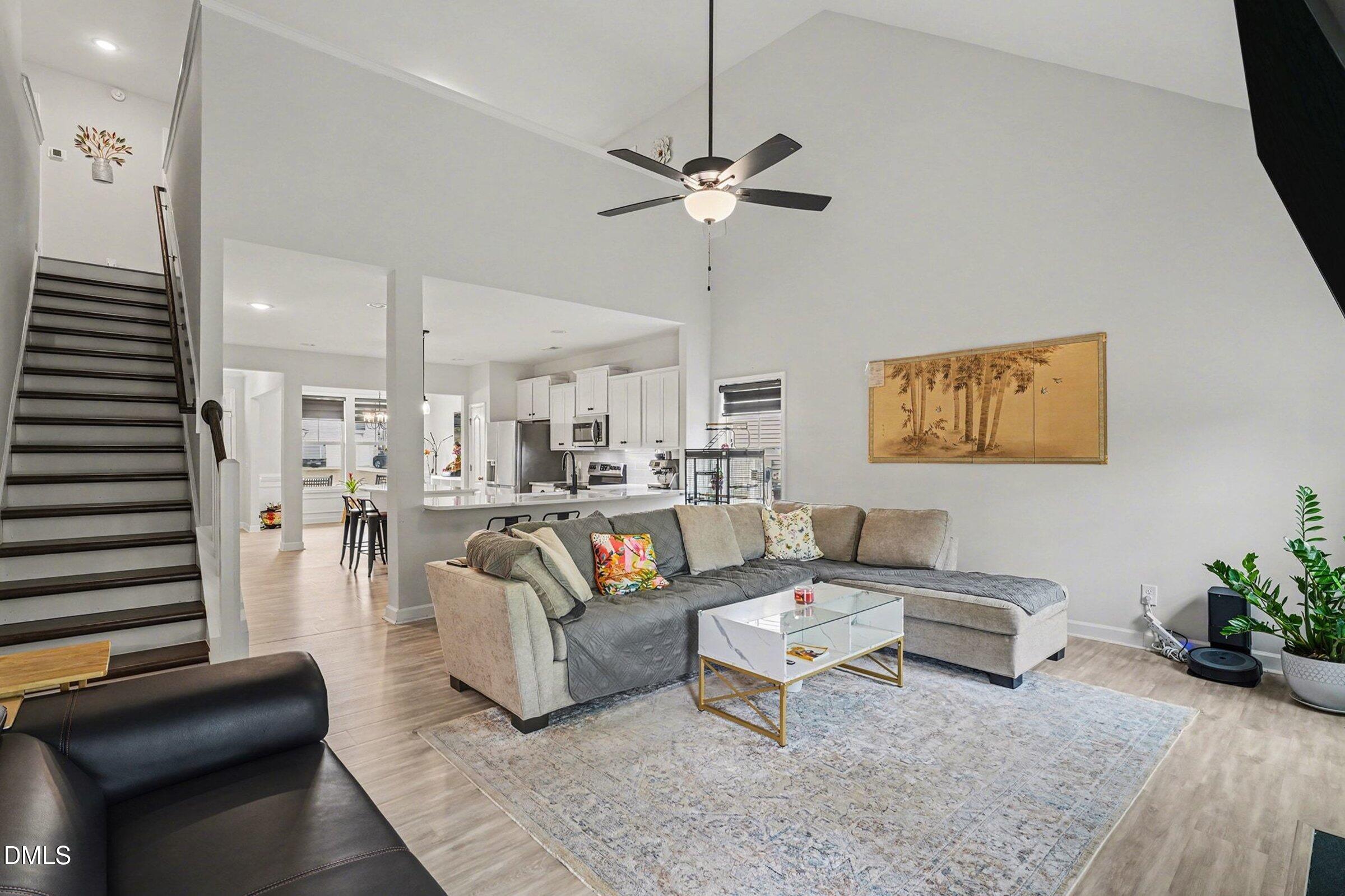365 Timber Skip Drive Spring Lake, NC 28390 - Photo 7 of 33 a living room with furniture and a chandelier