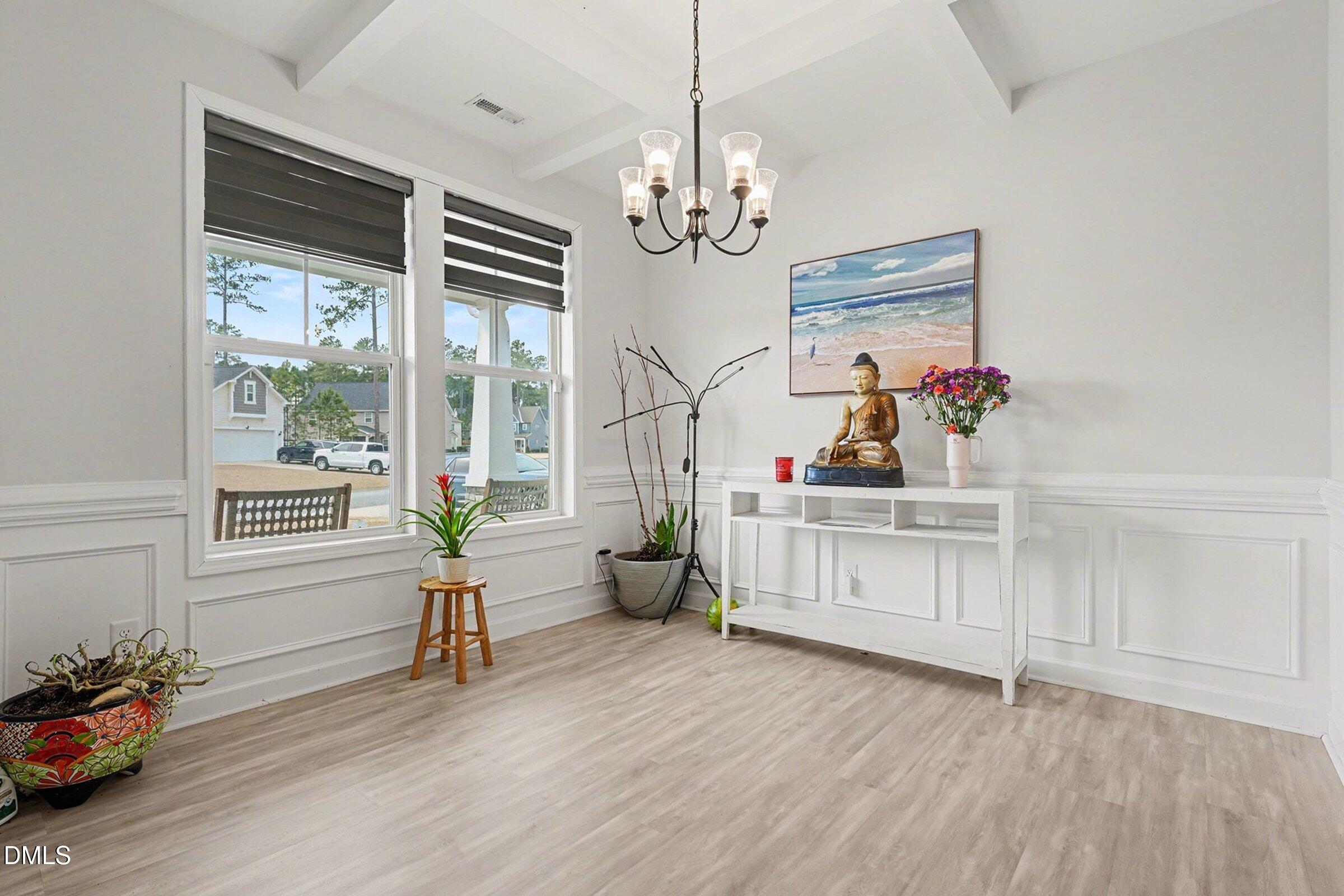 365 Timber Skip Drive Spring Lake, NC 28390 - Photo 9 of 33 a living room with furniture and a chandelier