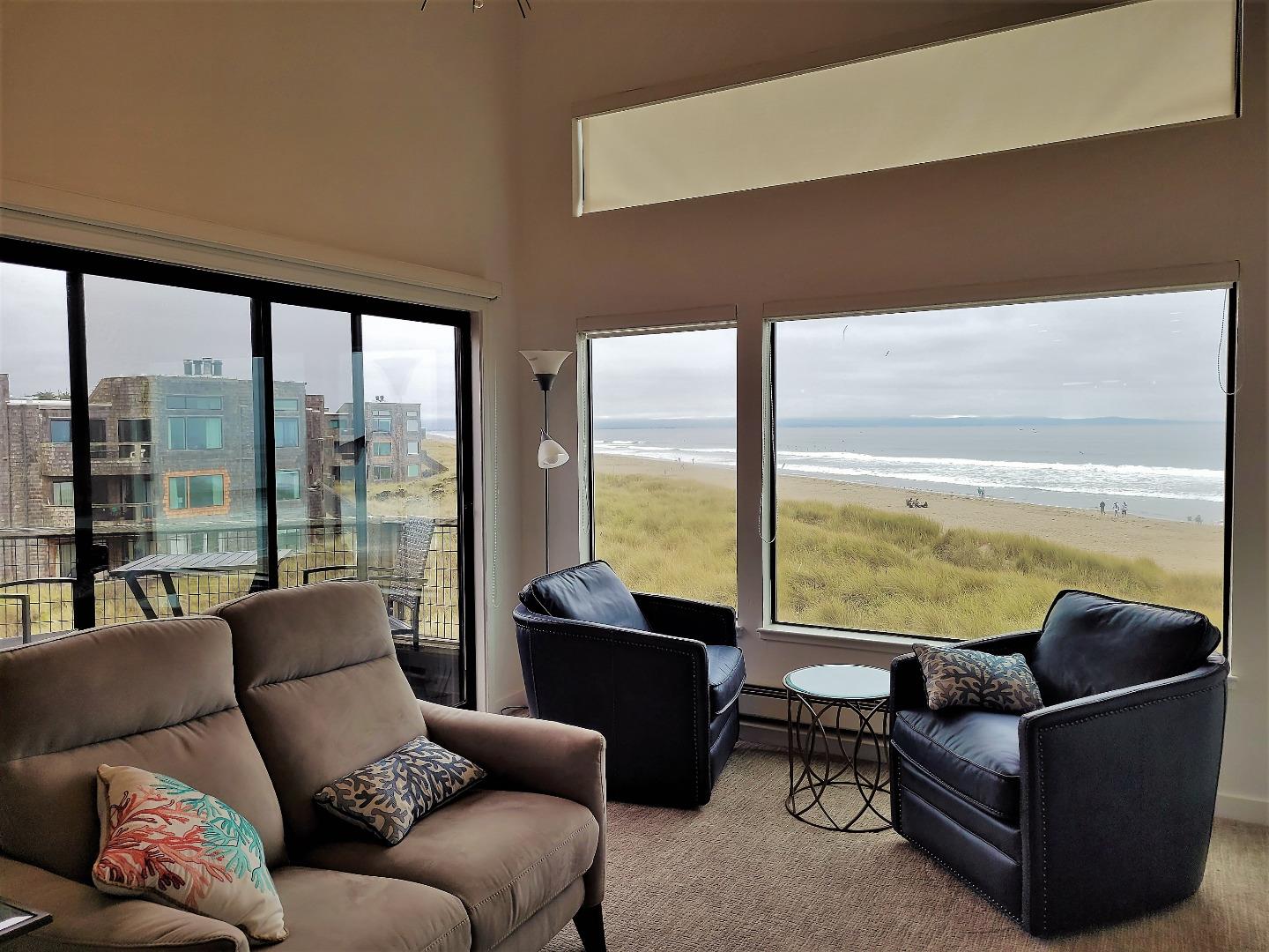 101 Shell Road, Unit 234 Watsonville, CA 95076 - Photo 7 of 18 a living room with furniture and floor to ceiling windows