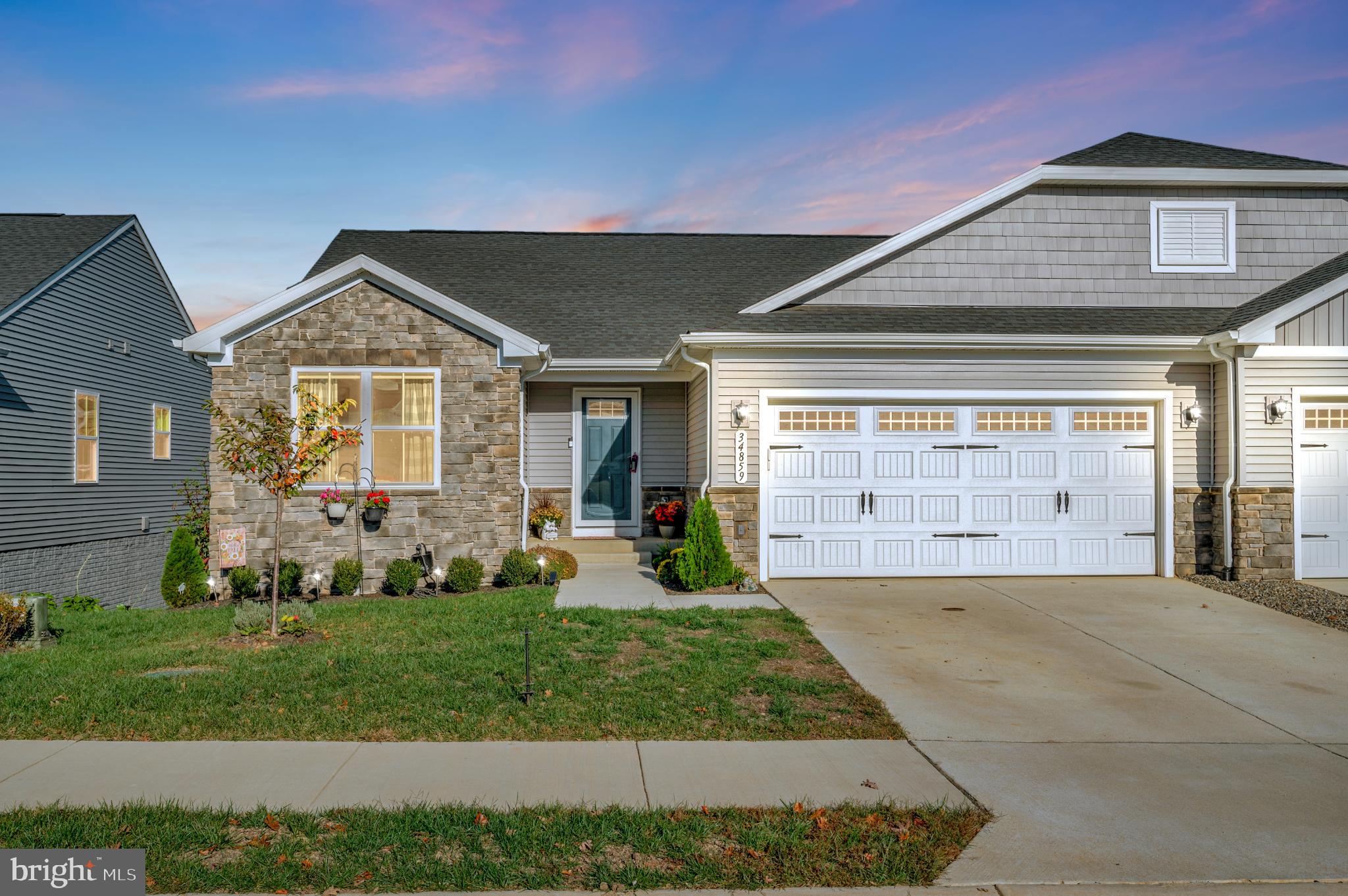 a front view of a house with garden