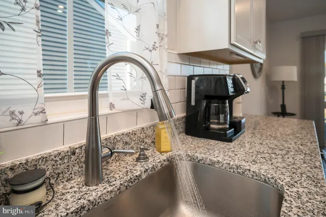 a kitchen with a table and chairs in it