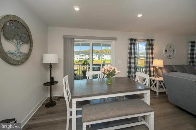 a spacious bedroom with a bed and a window