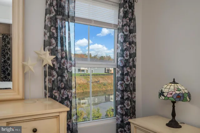 a bathroom with a shower curtain and a toilet