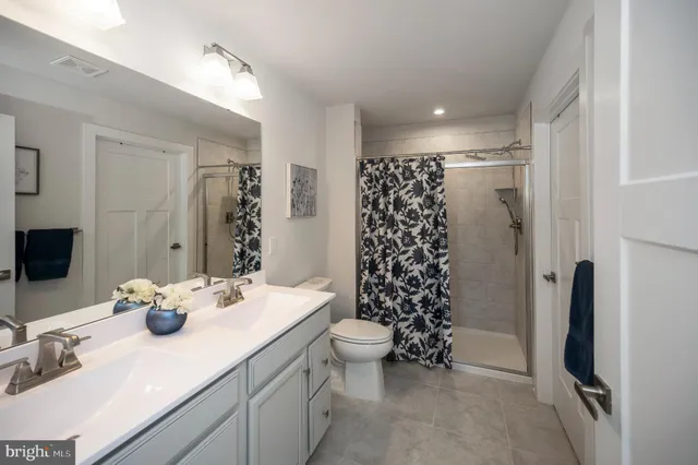 a bedroom with a large bed and a closet