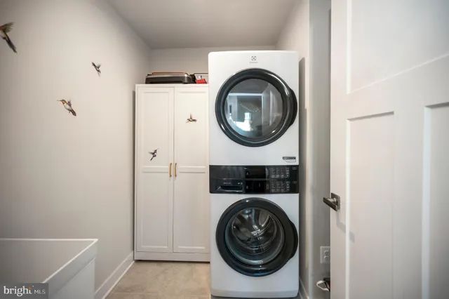 a view of a house with pool and a yard