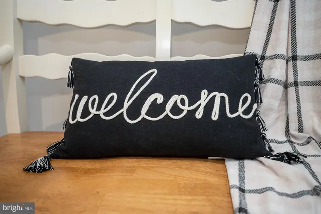 a living room with furniture flat screen tv and fireplace
