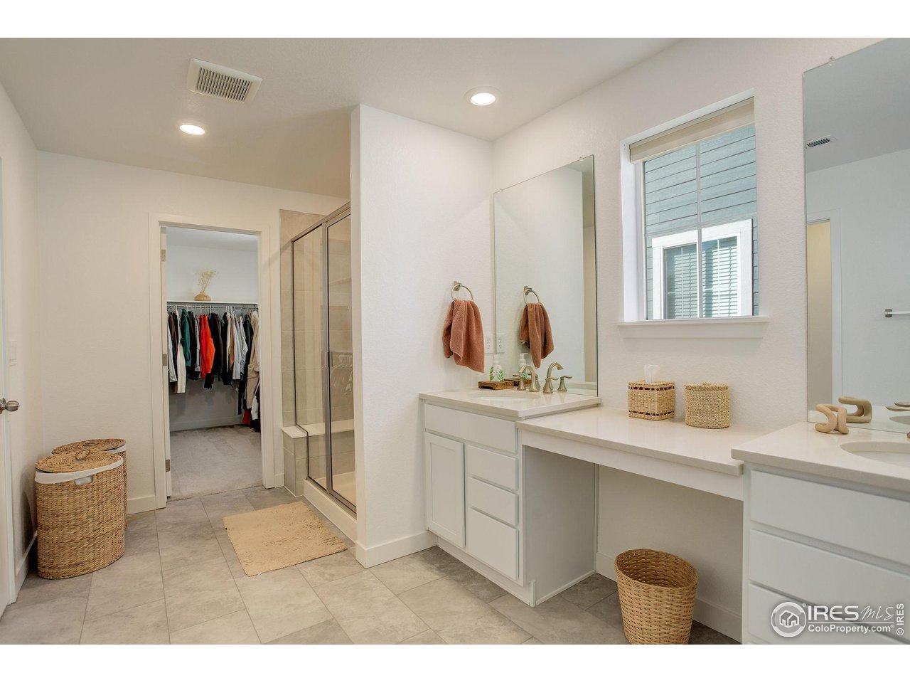 1881 Miranda Road Erie, CO 80516 - Photo 25 of 36 Primary bathroom with double vanity and walk in shower